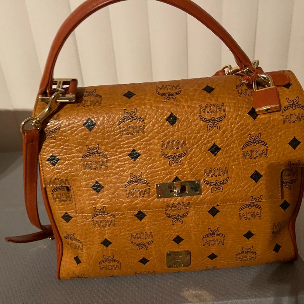 It’s authentic with dust bag , good condition, no flaws or tear
